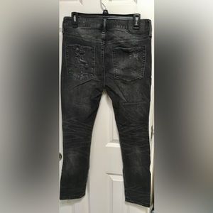 American Eagle Men’s black patched jeans.